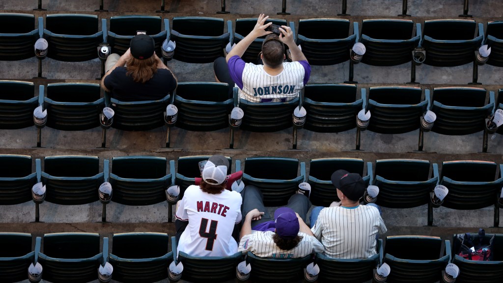 Fans look before Game Four of the World Series between the Texas Rangers and the Arizona Diamondbacks at Chase Field on October 31, 2023 in Phoenix, Arizona.