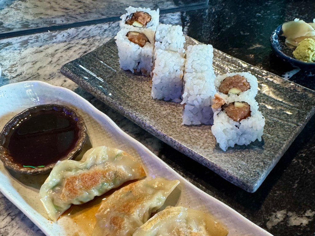 A spicy tuna roll and gyoza from Kanoki Sushi & Cocktails.