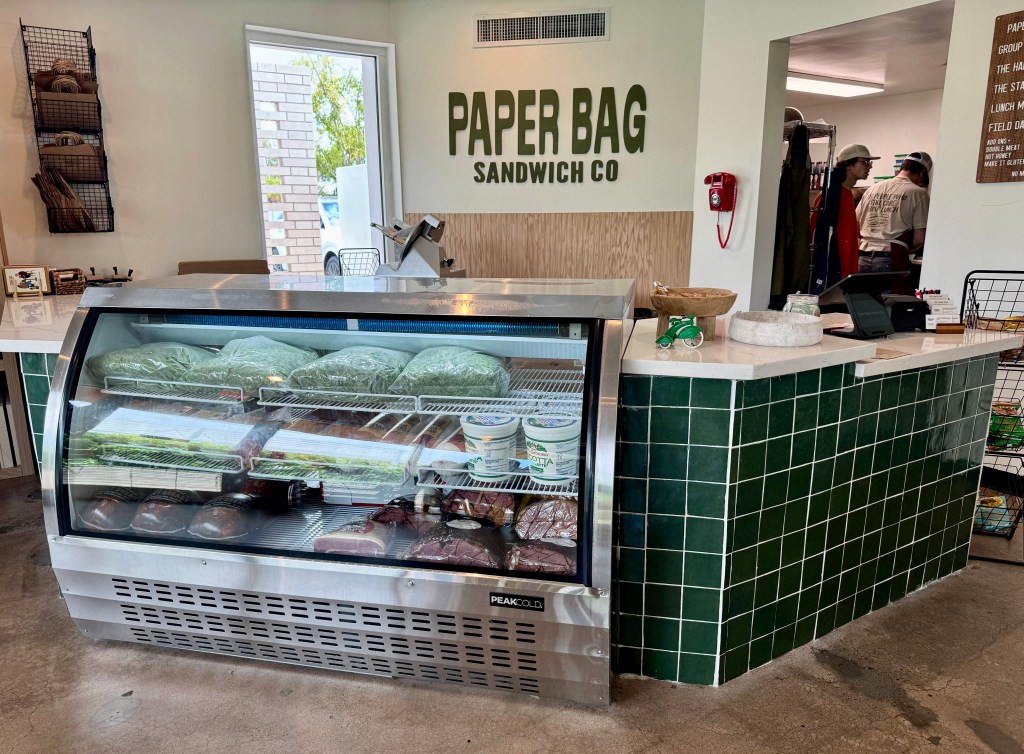 The counter and deli case inside Paper Bag Sandwich Co. in Phoenix.