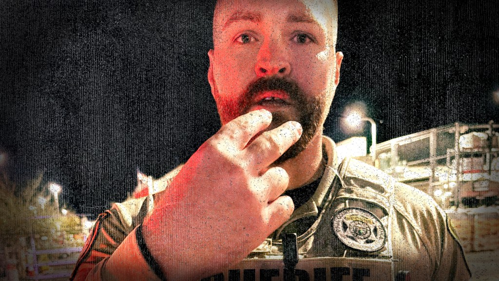 pinal county sheriff's deputy aaron mcrae points at his own face
