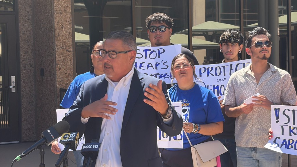 steve gallardo speaks at an outdoor press conference