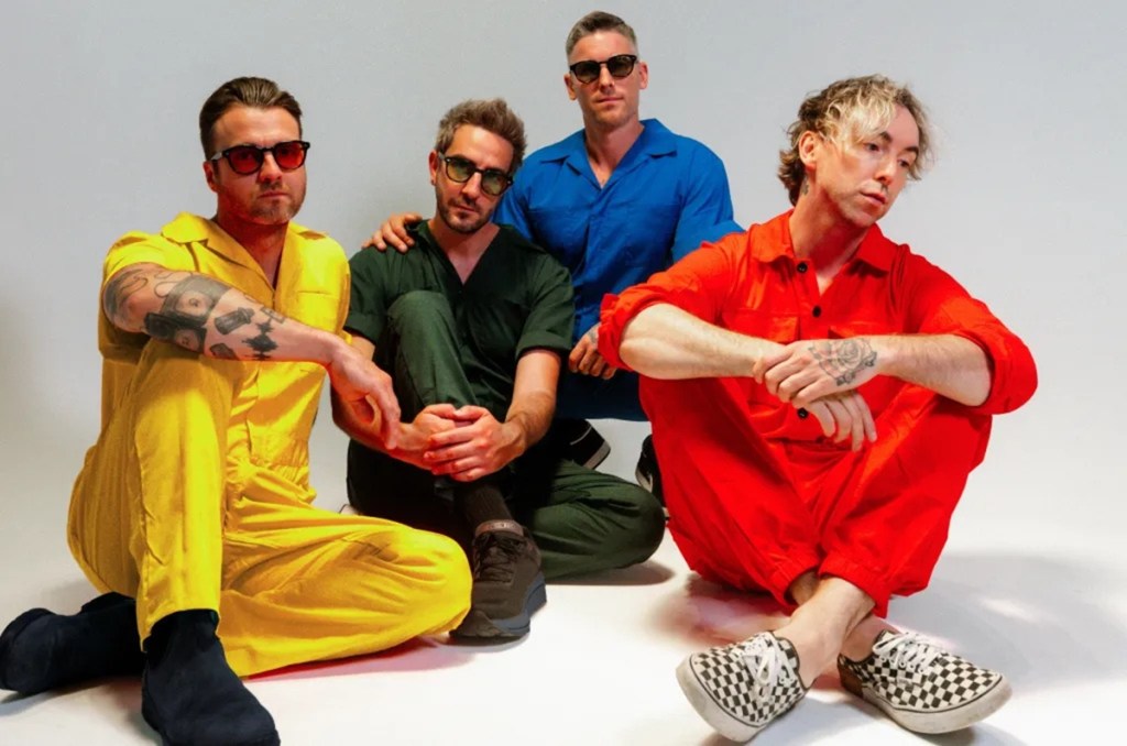 Members of All Time Low pose in colorful jumpsuits. The pop-punk band will perform at the 2026 Arizona State Fair.