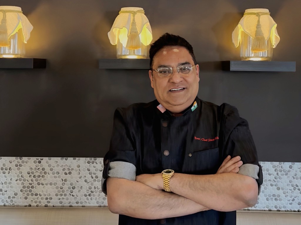 Bahaara Indian Kitchen chef and owner Jiten Sibal poses in his restaurant's dining room.