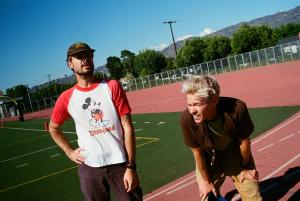 Sam Means, left, and Nate Ruess of Arizona indie rock band The Format pose on a running track in a promotional photo.