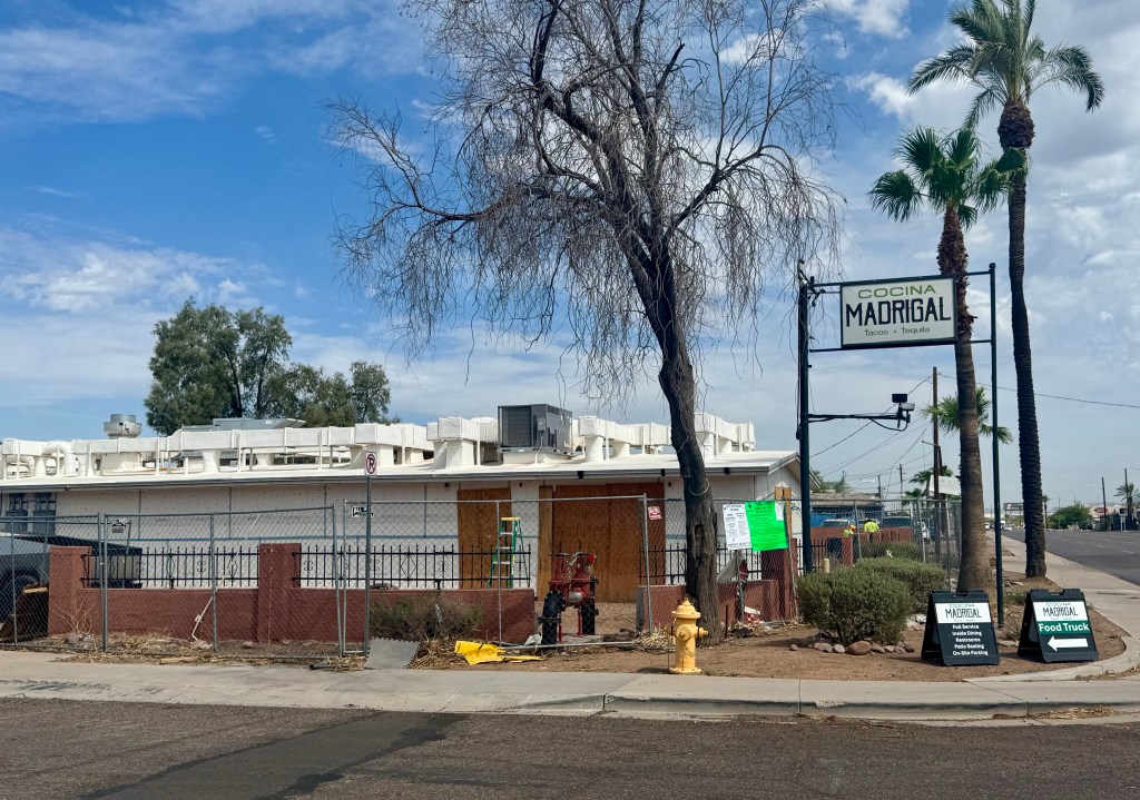 A fence encircles Cocina Madrigal while the restaurant is renovated from a fire.