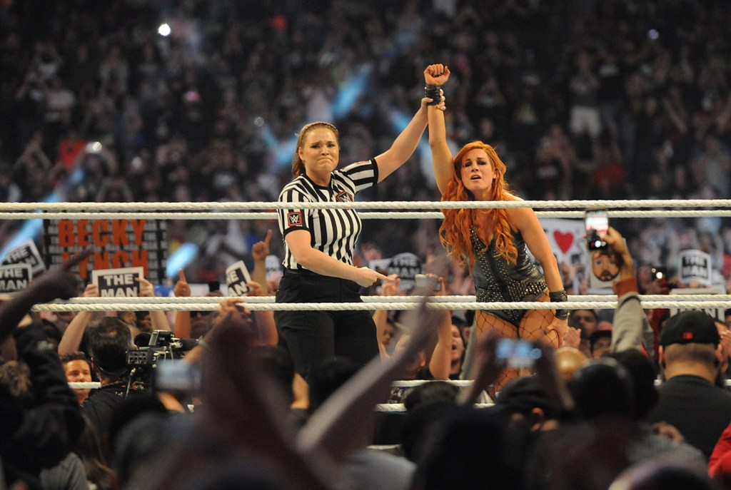 A female referee raises Becky Lynch’s arm after she wins the 2019 WWE women’s Royal Rumble match at Chase Field in Phoenix.