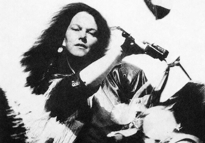 Radio DJ Mary McCann rides her Harley in a 1991 photo.