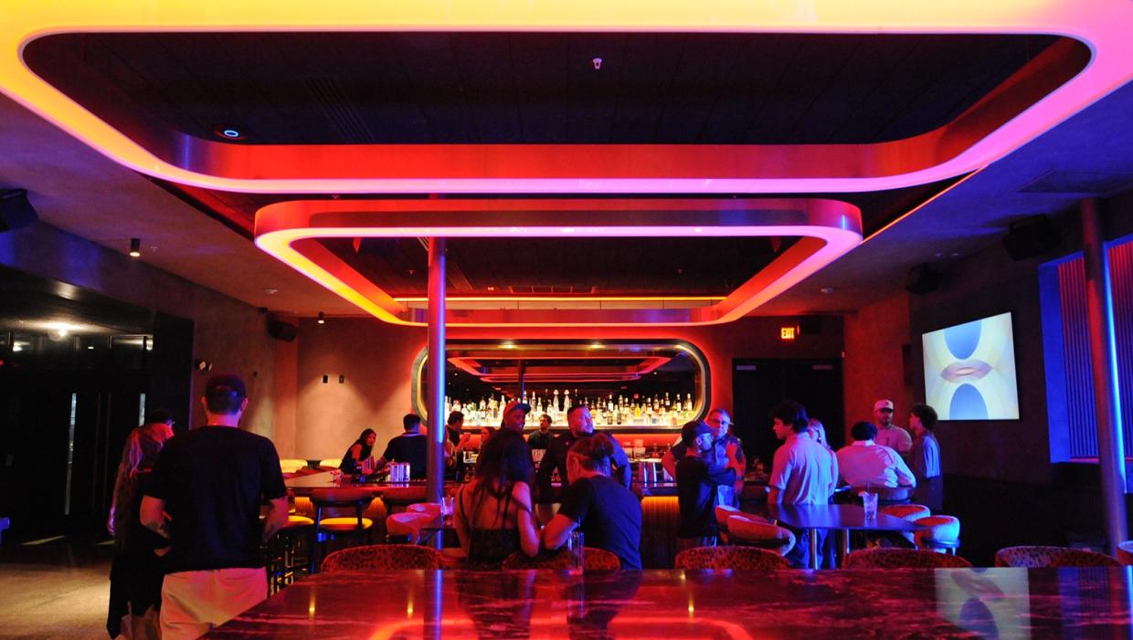 Red lighting illuminates the interior of Roosevelt, a new nightspot in downtown Phoenix