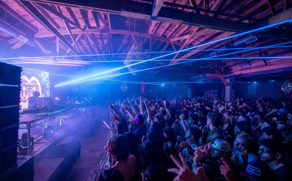 Lasers shine over a crowd at an EDM show inside Warehouse 215 in downtown Phoenix.