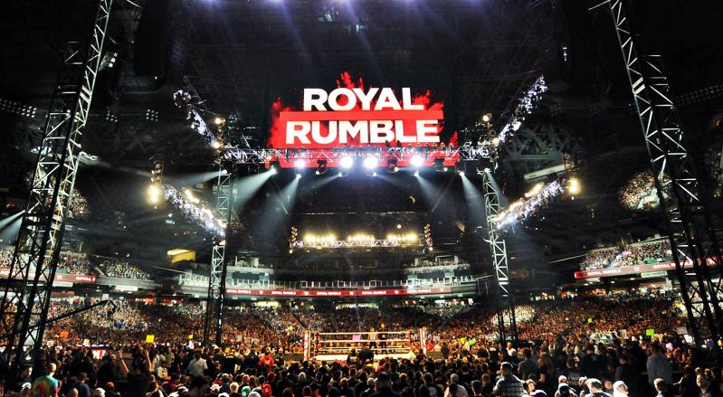 A packed Chase Field during WWE Royal Rumble 2019 in Phoenix, with the wrestling ring and Royal Rumble logo visible.