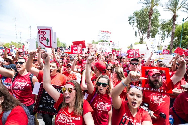 teachers in red at a protest