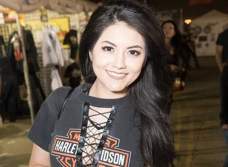 A woman with black hair poses for a photo at Arizona Bike Week.
