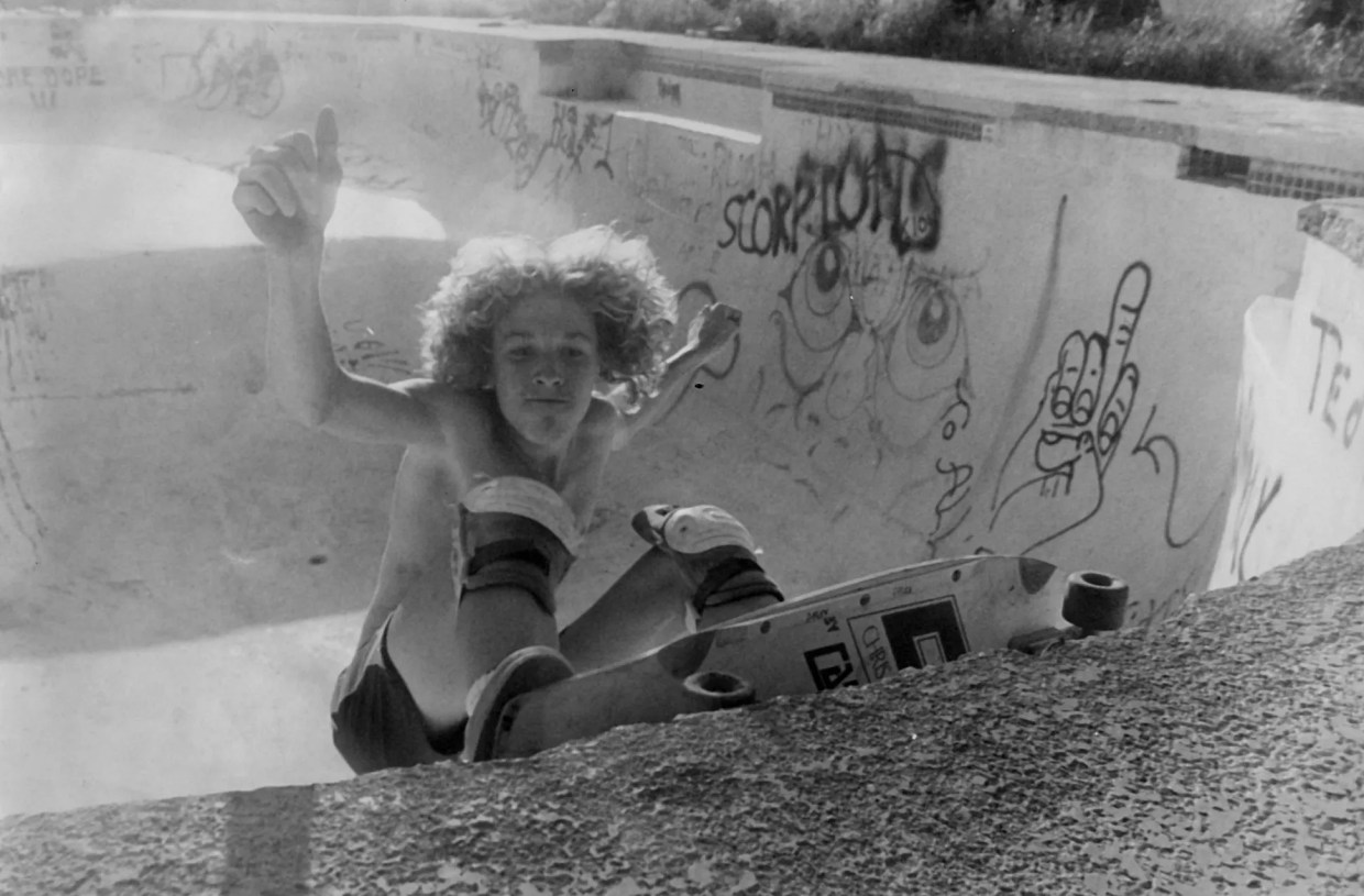 A historical photo of a skateboarder
