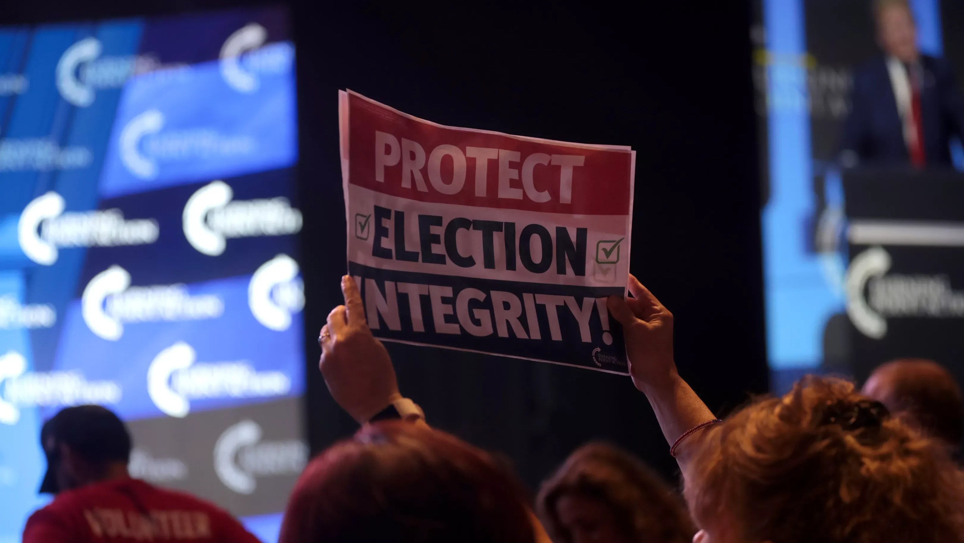 A sign at the "Rally to Protect Our Elections" hosted by Turning Point Action at Arizona Federal Theatre in Phoenix in 2022.