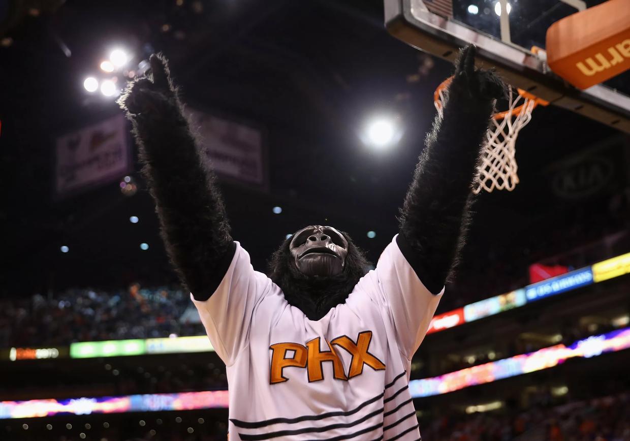 a person in a gorilla suit wearing a suns jersey