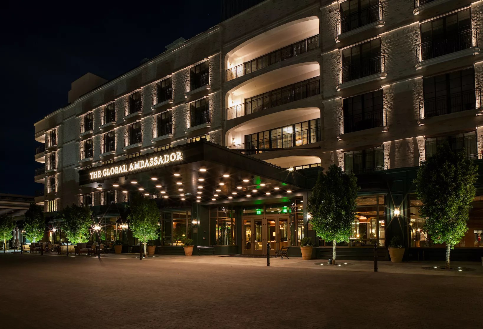 The Global Ambassador exterior at night.
