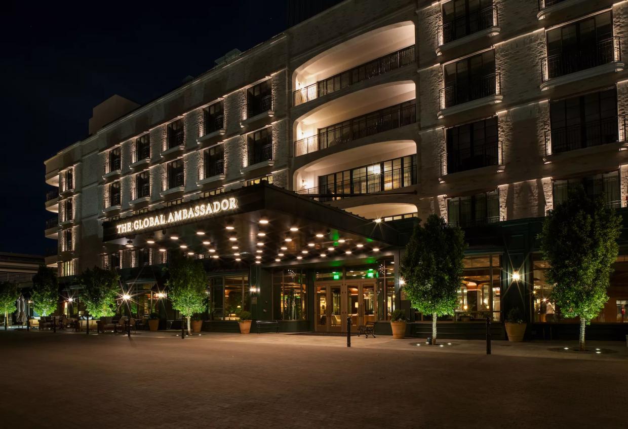 The Global Ambassador exterior at night.