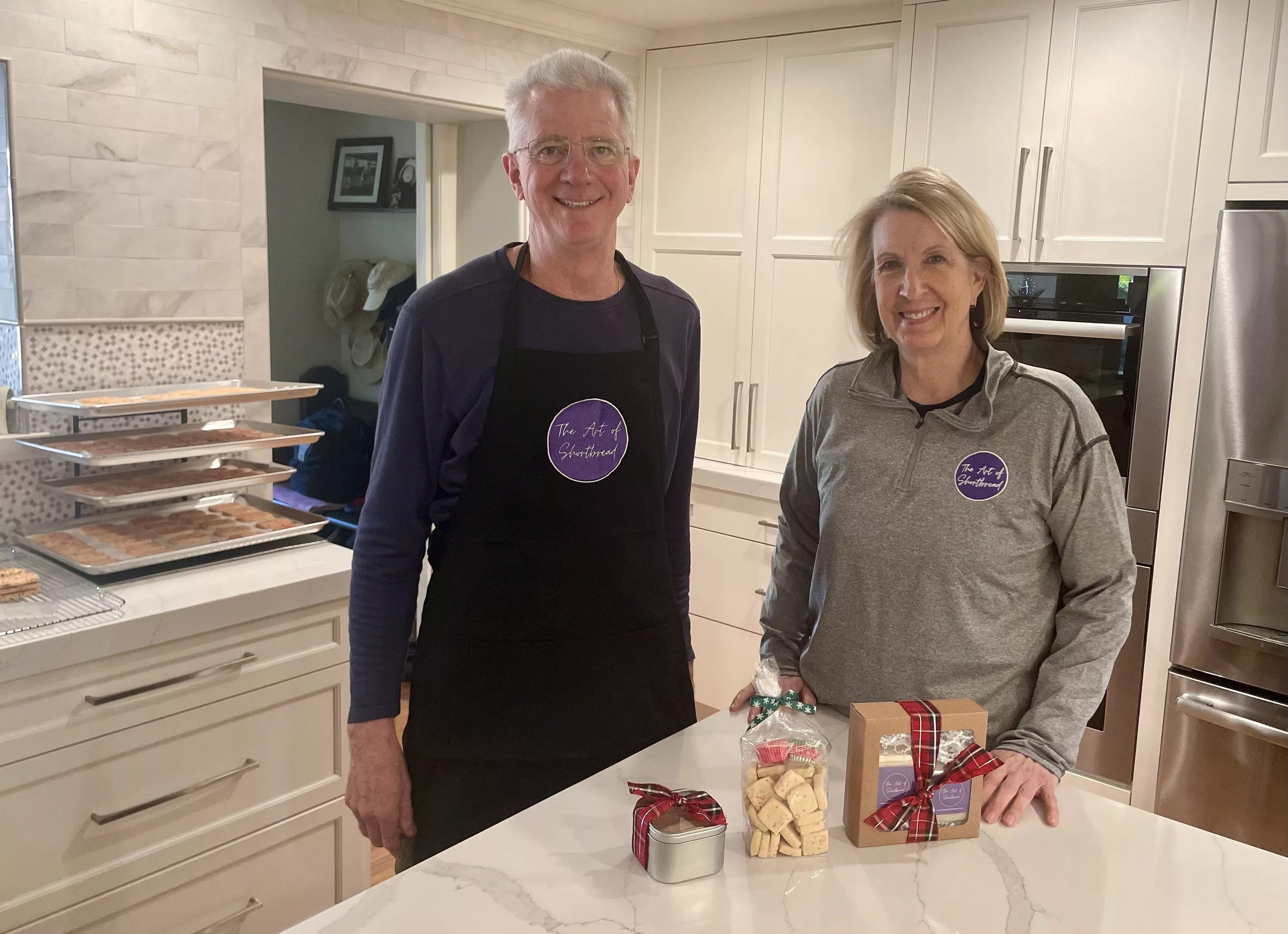 Art and Kathy Rowland stand in their kitchen.