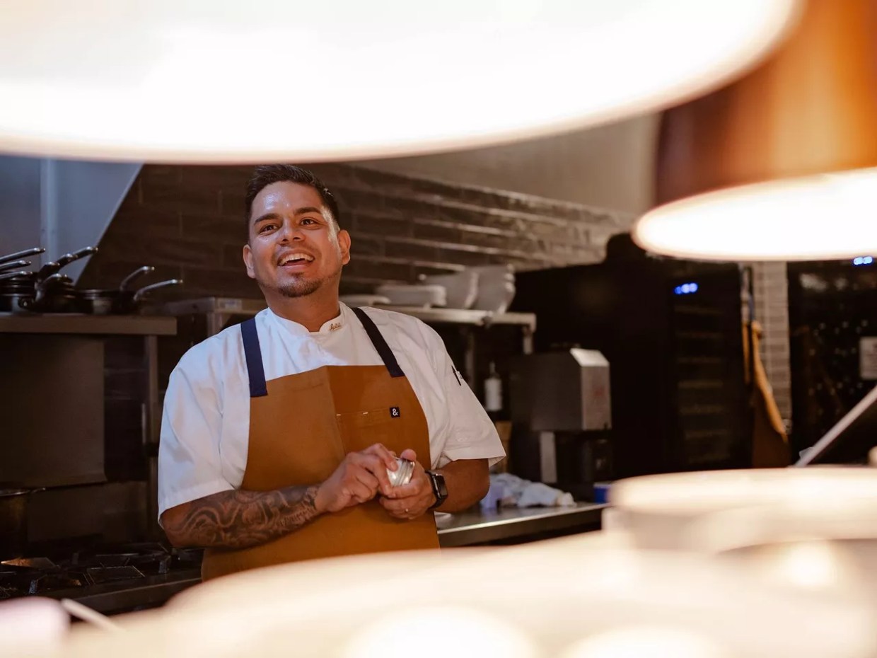 Chef Ivan Jacobo stands in his restaurant.