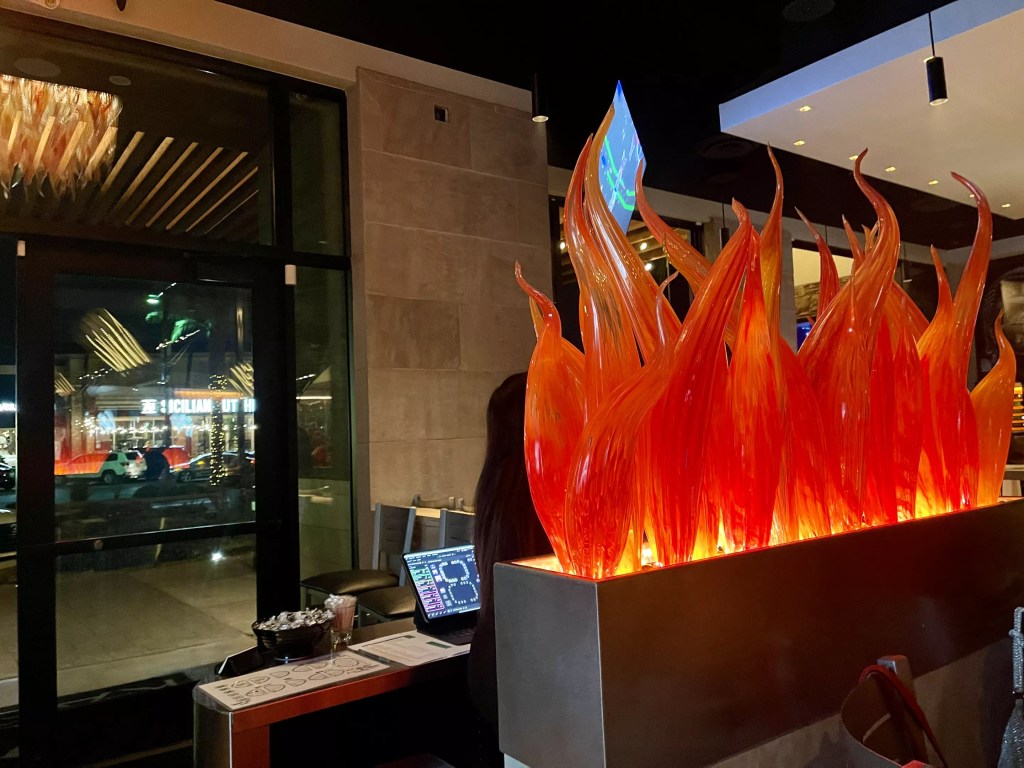 Blown glass flames behind the host stand at Kasai.