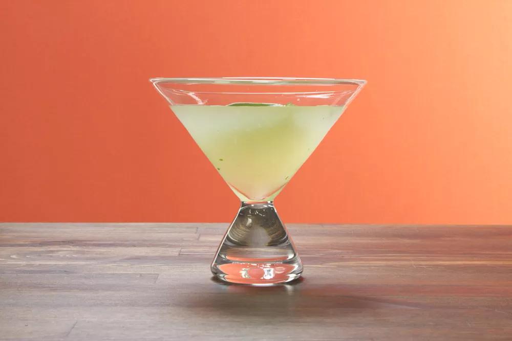 Martini glass with orange background.
