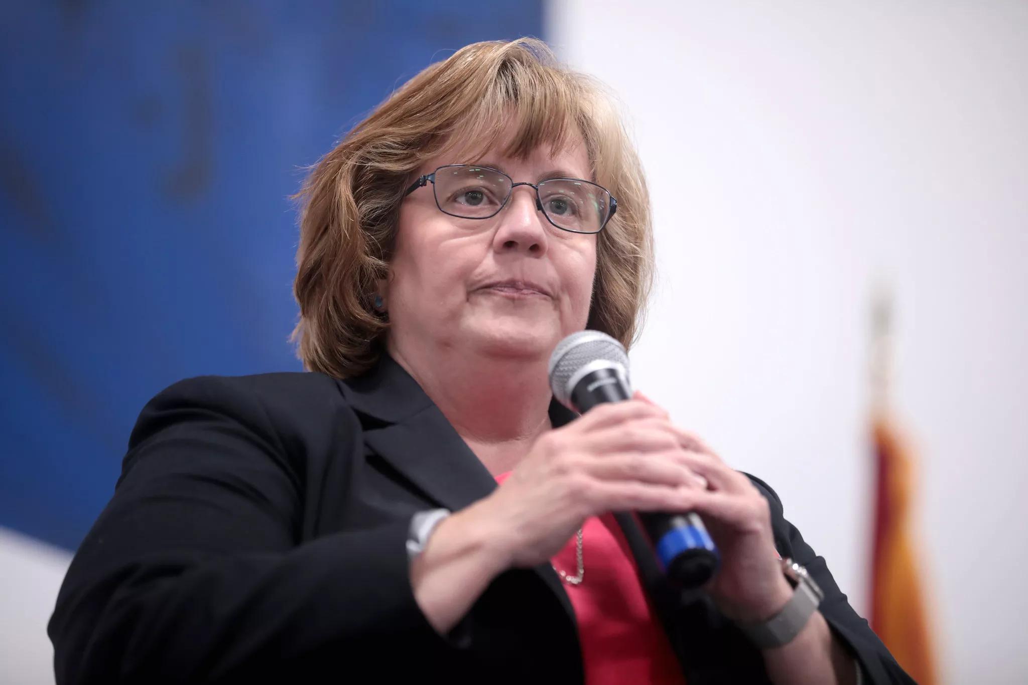 Rachel Mitchell holding a microphone