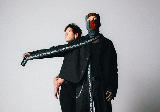 Two men posing for an artistic picture.