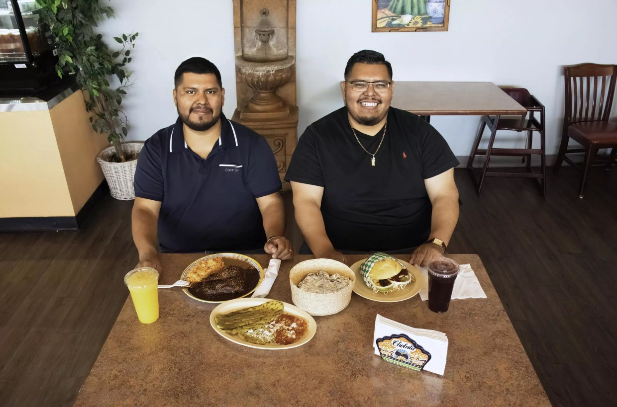 Two men at a table.