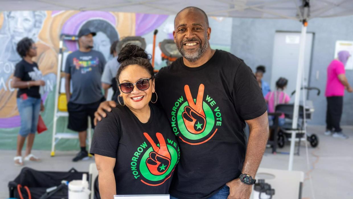 Two people in matching T-shirts.
