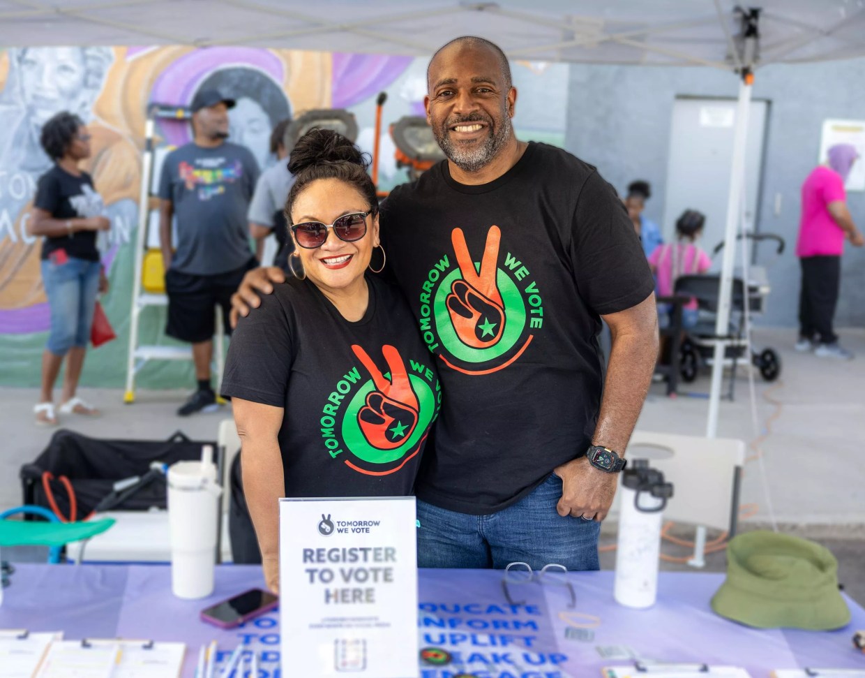 Two people in matching T-shirts.