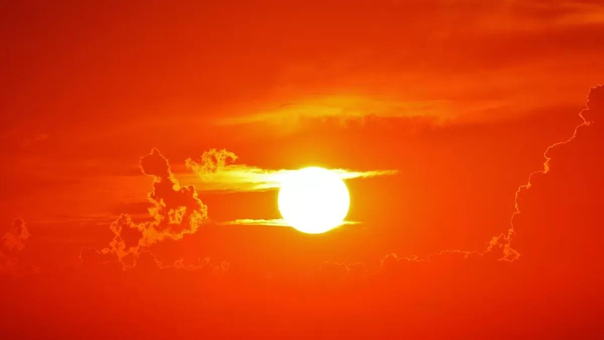 a sun in an orange sky