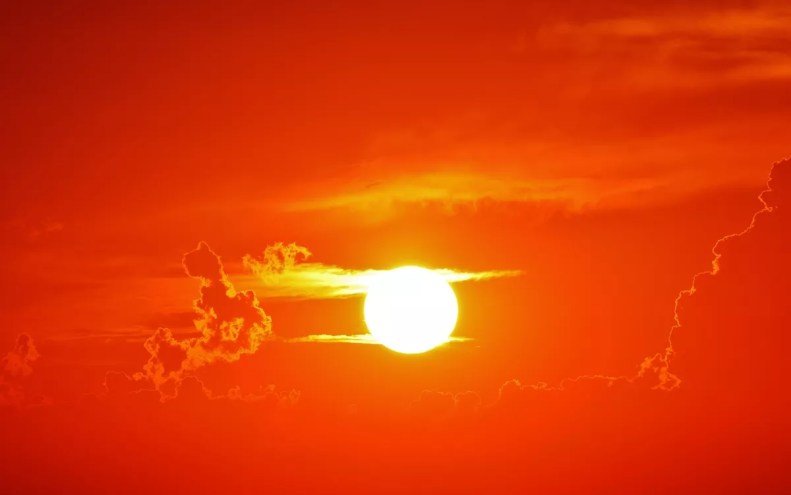 a sun in an orange sky