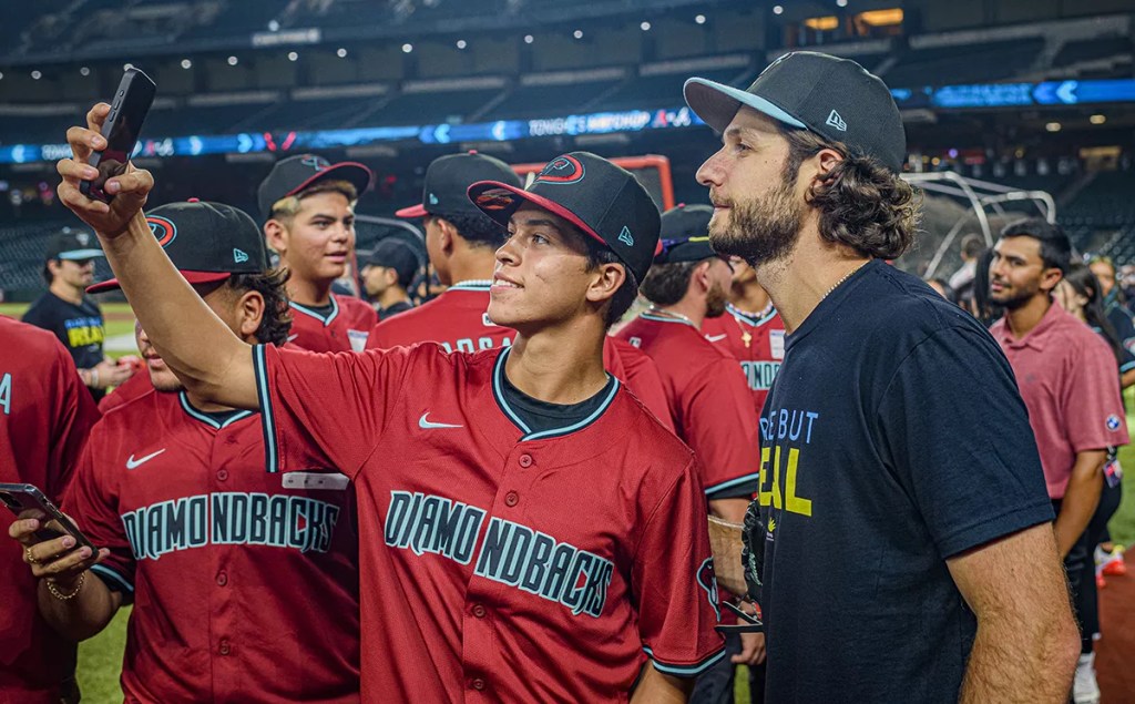 Youth baseball players take a selfie with Zac Gallen