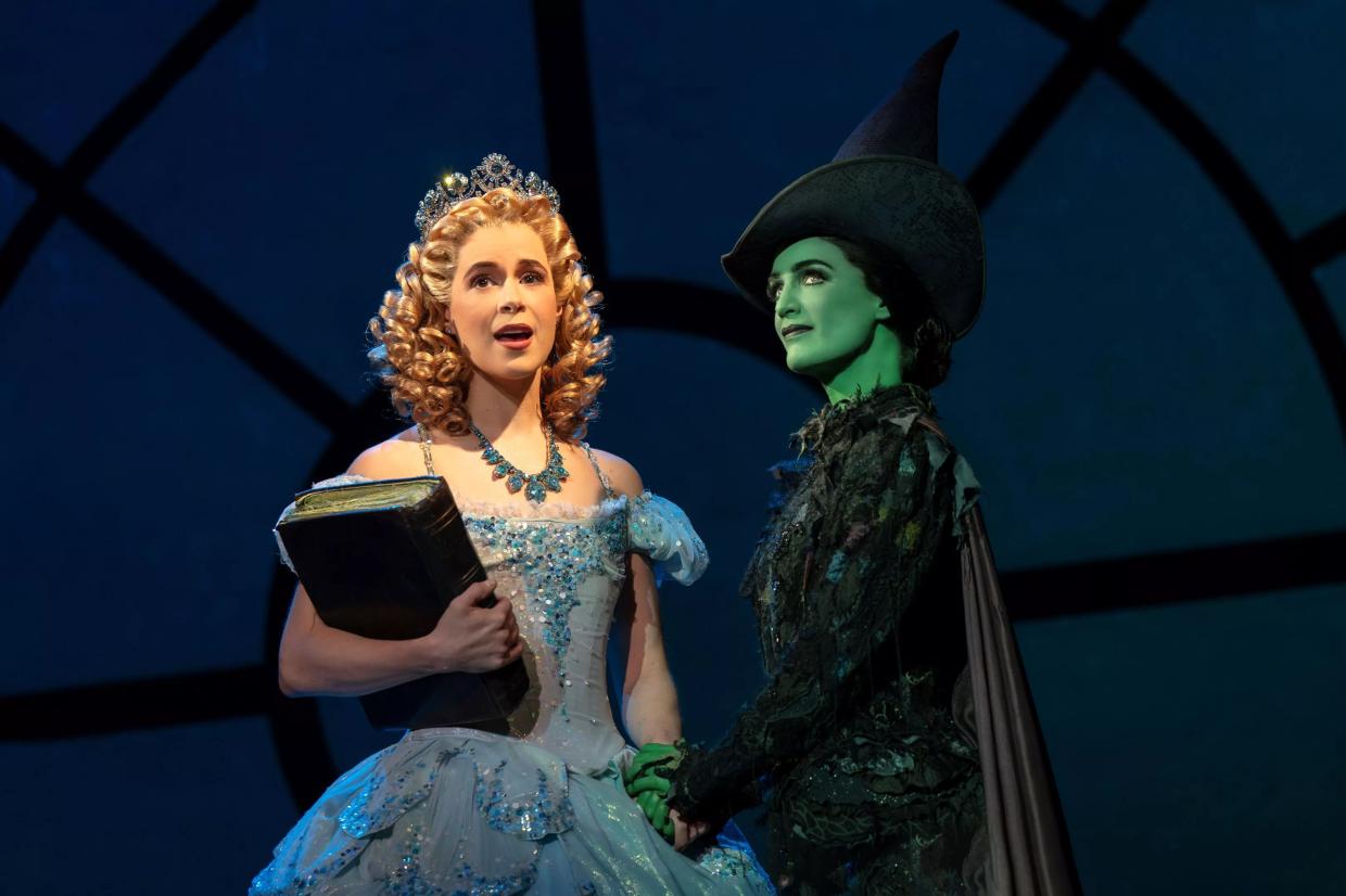 Two women dressed as a princess and a witch.