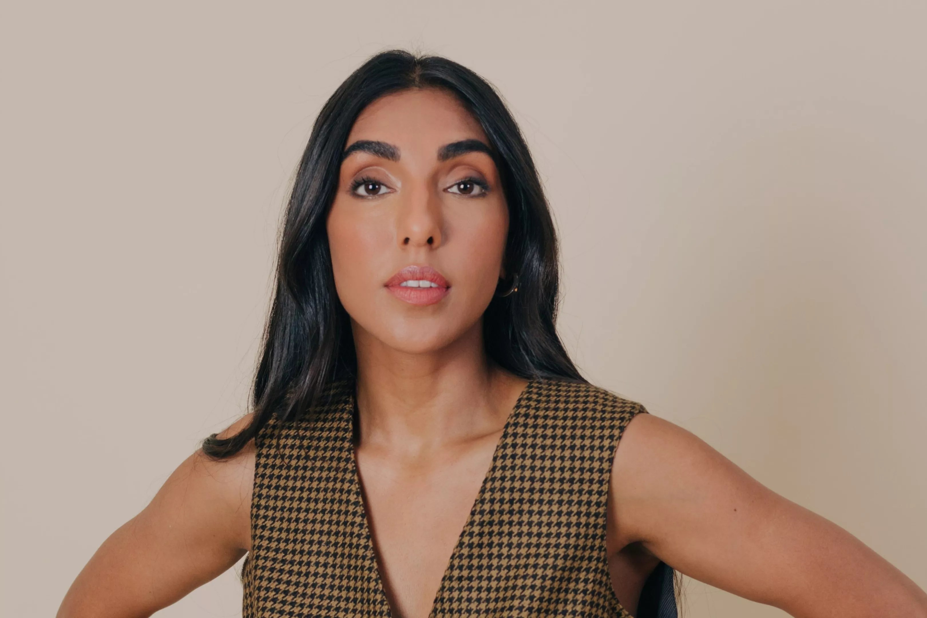 A portrait of a young woman of color.
