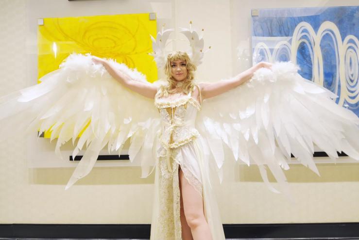 A woman dressed in a winged costume.