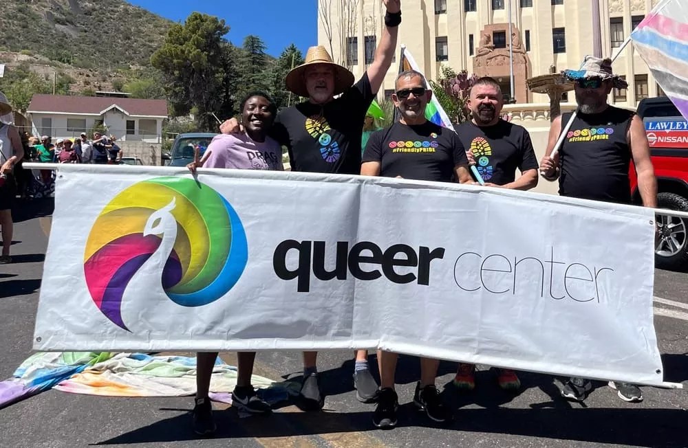 A group of people holding a banner.