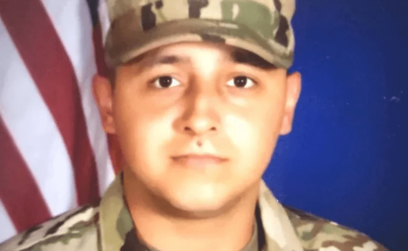 a headshot of a man in military camouflage