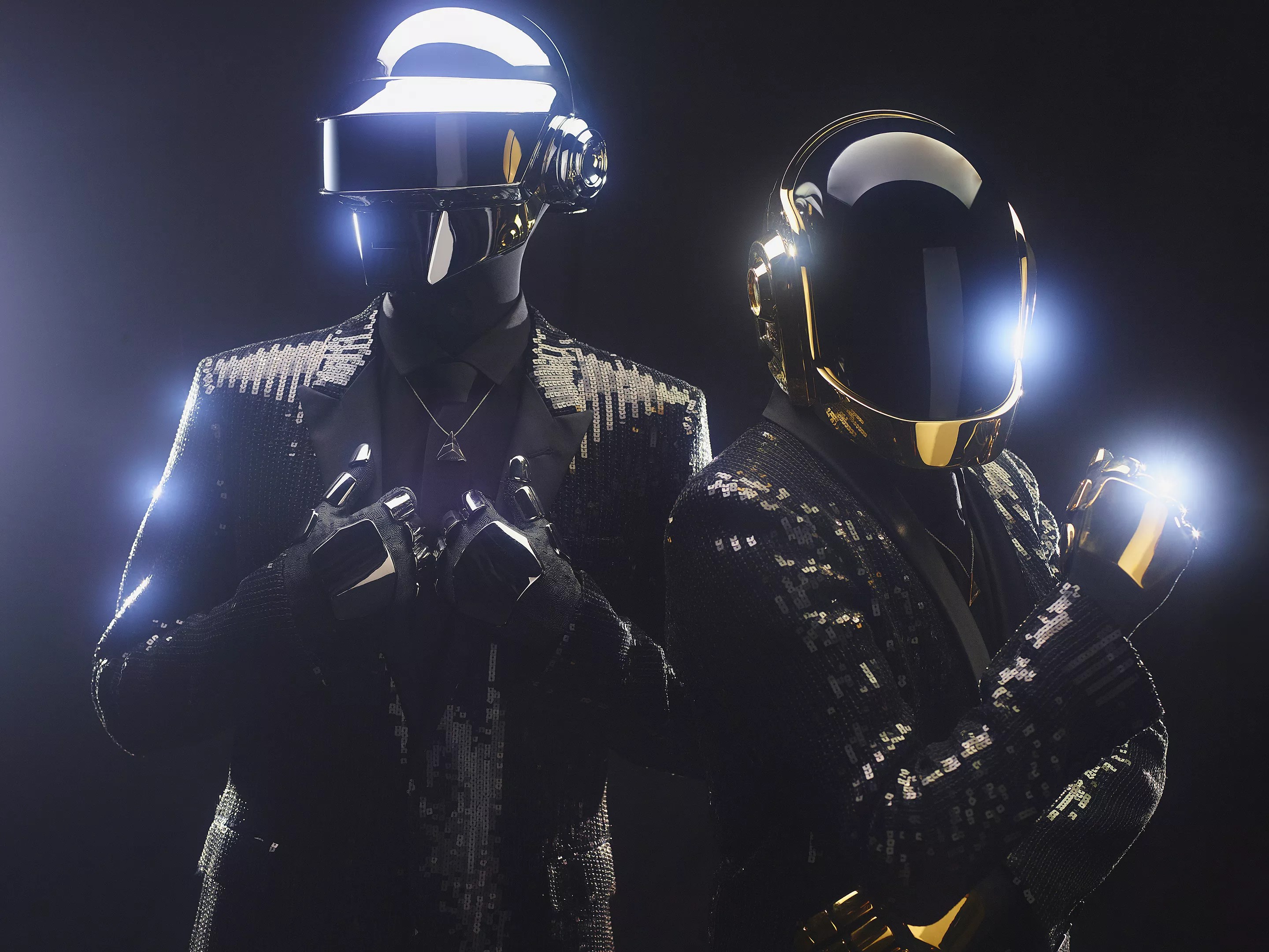 Two men in costumes with helmets.
