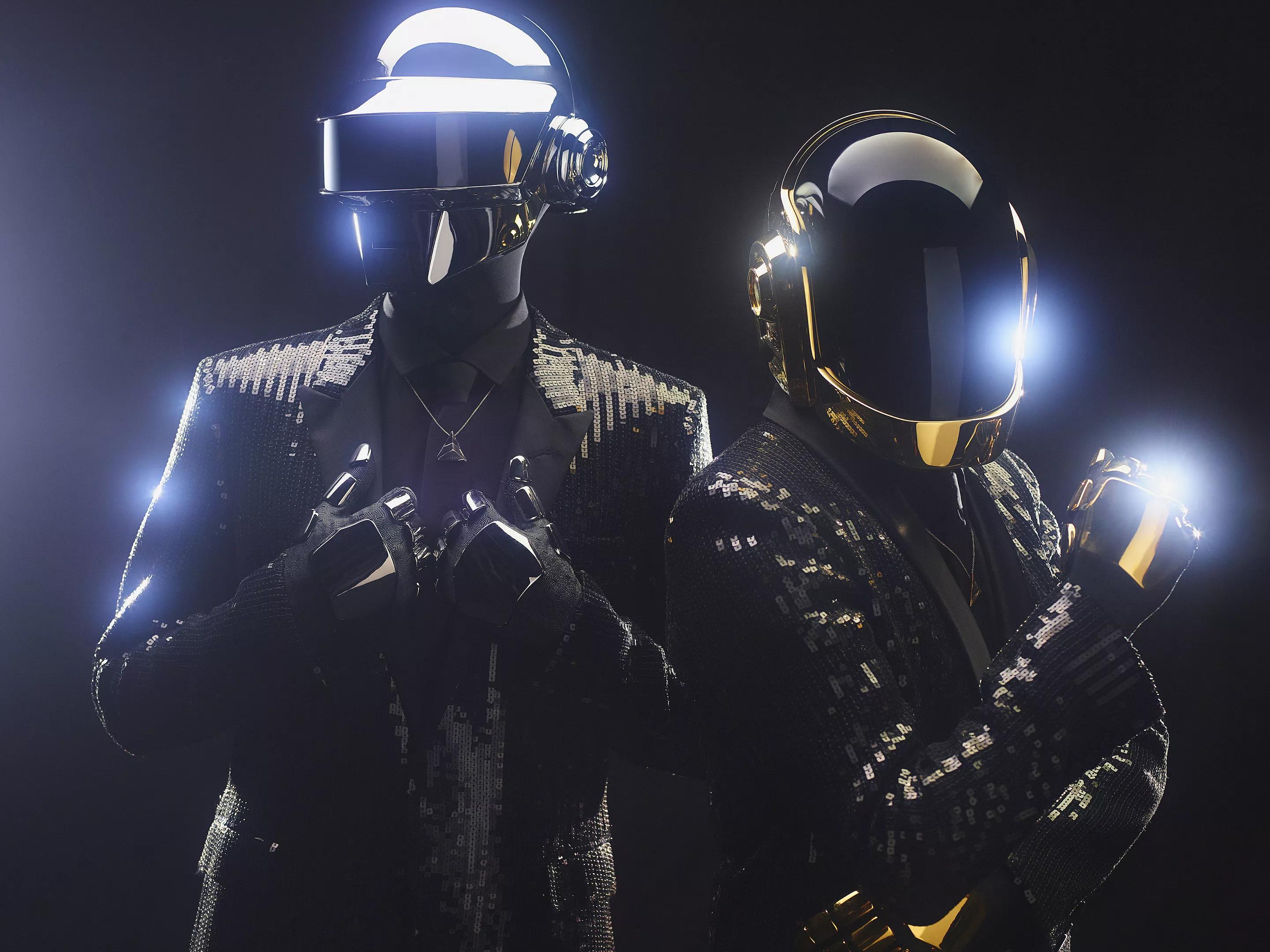 Two men in costumes with helmets.