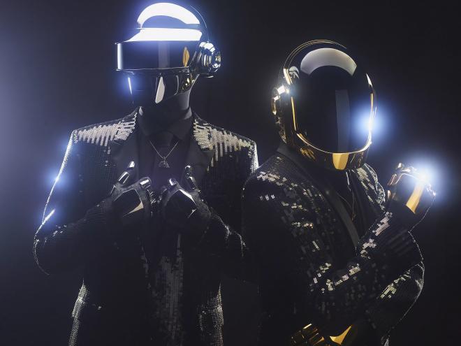 Two men in costumes with helmets.