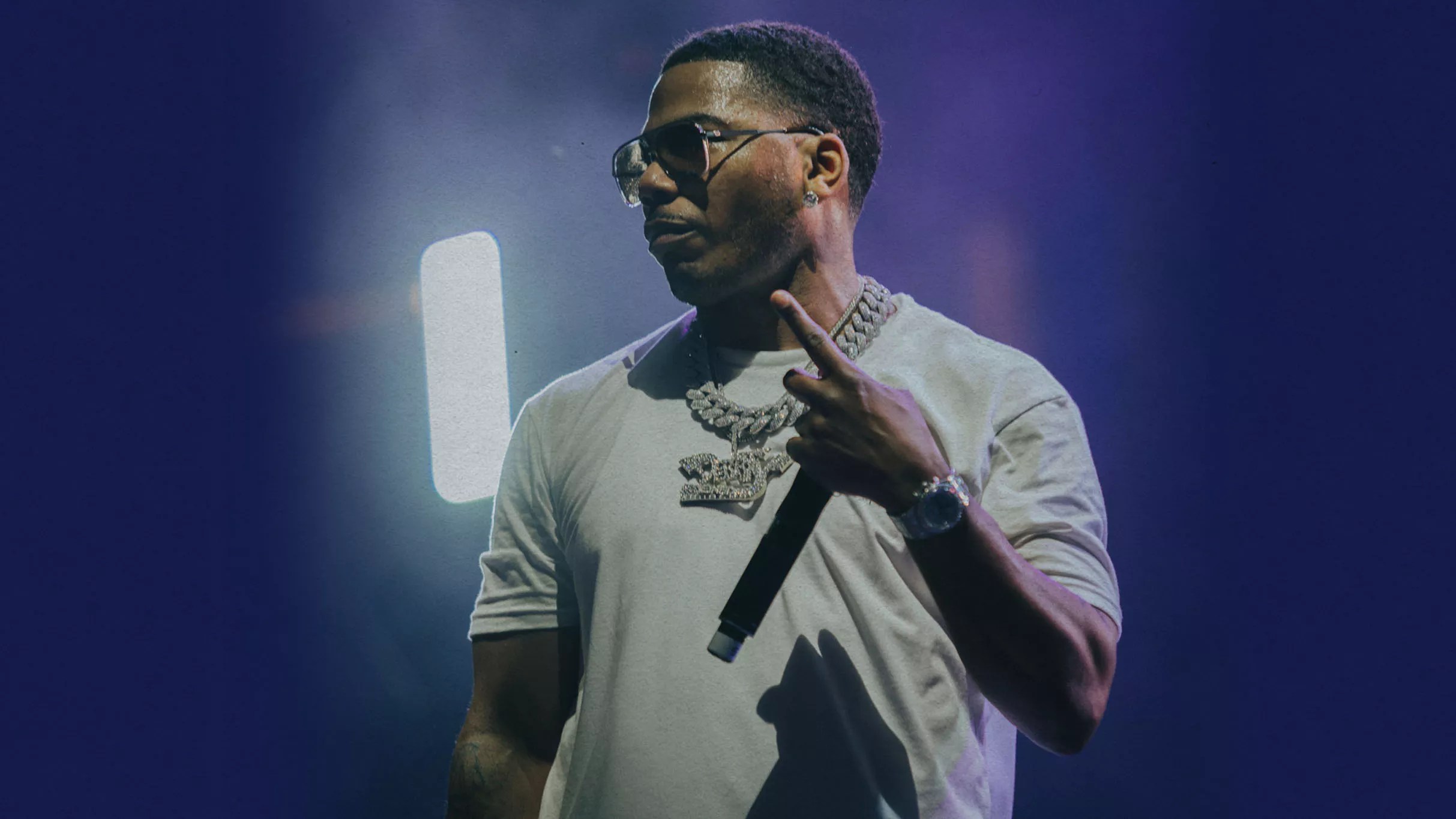 A Black man with a microphone.