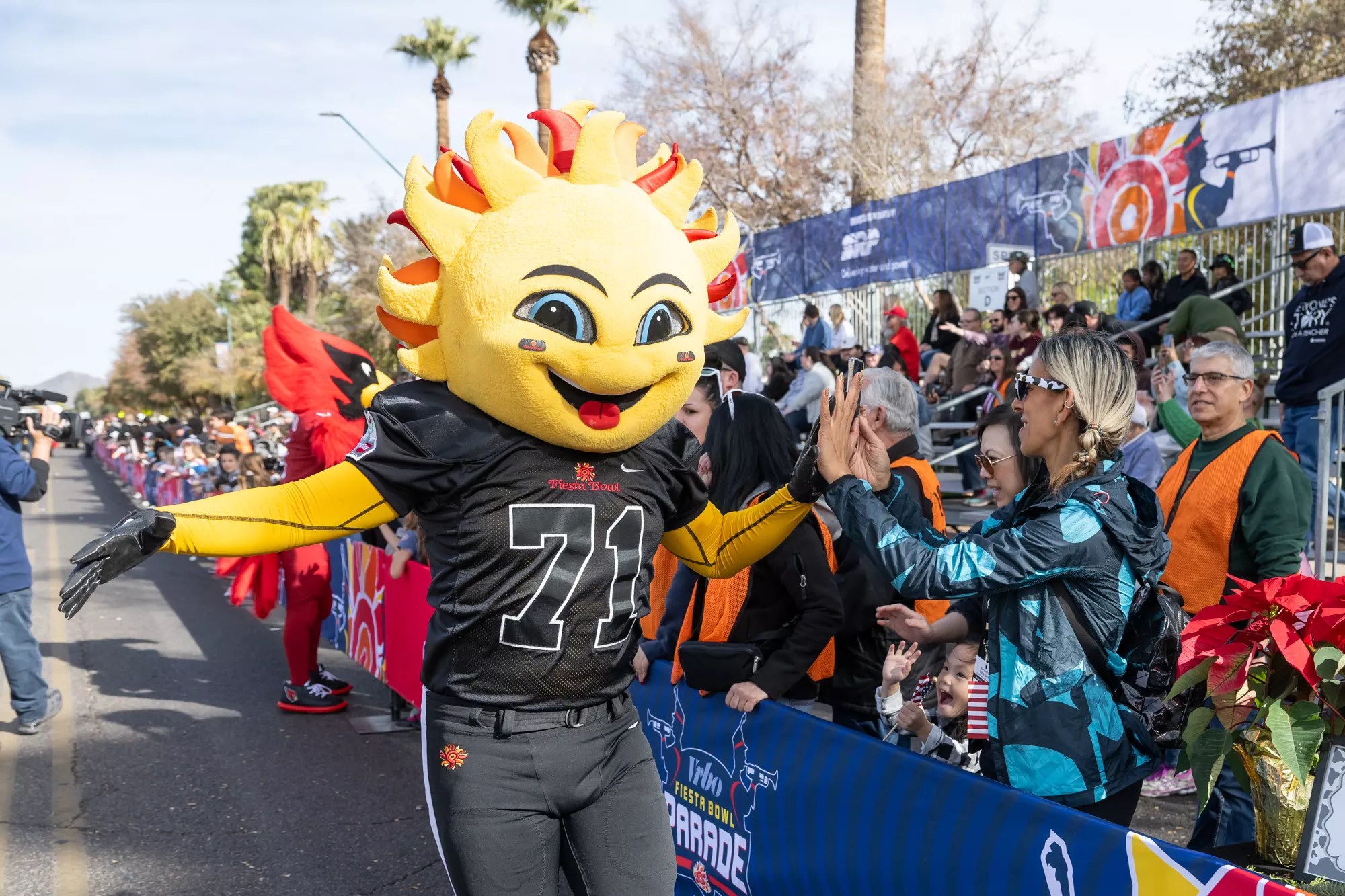 A person in a costume interacting with the public.
