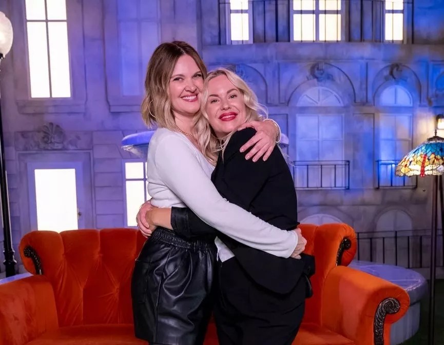 Two women hugging.