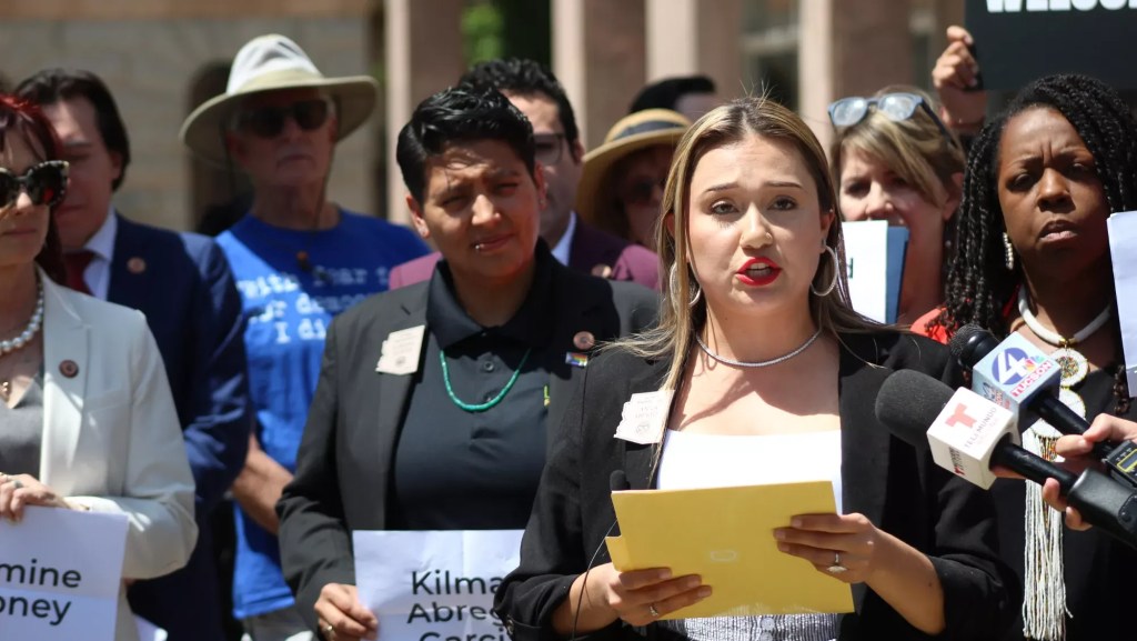 anna abeytia speaks at an outdoor press conference