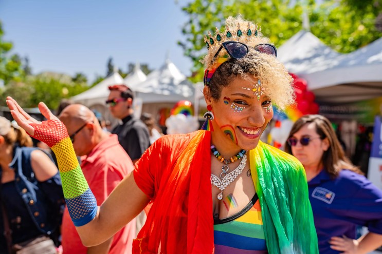 A member of Arizona's LGBTQ community dressed in colorful costuming at Rainbows Festival in Phoenix.