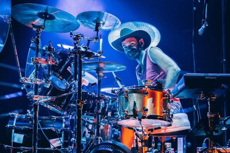 man plays drums