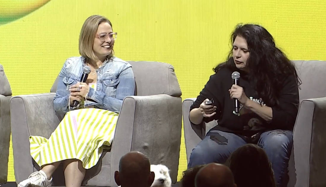 kyrsten sinema and sue sisley on a stage