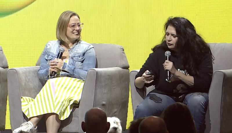 kyrsten sinema and sue sisley on a stage